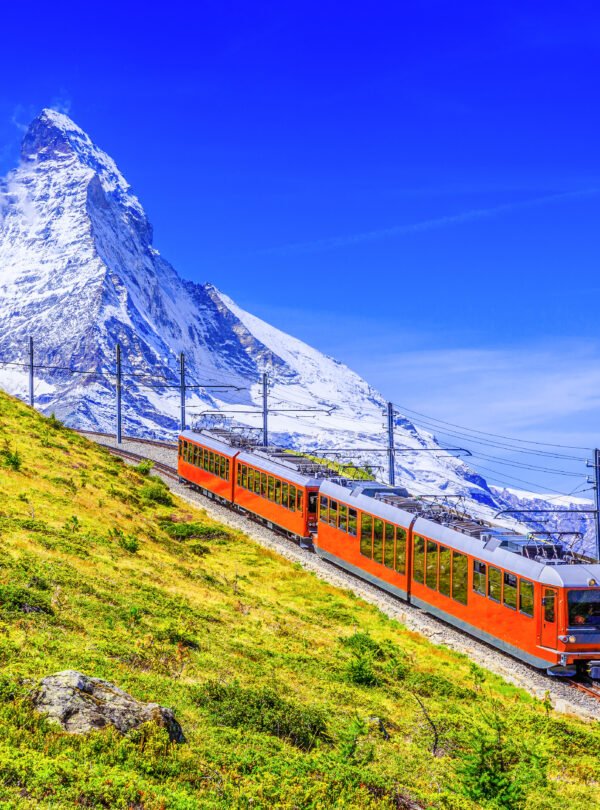 Zermatt,,Switzerland.,Gornergrat,Tourist,Train,With,Matterhorn,Mountain,In,The